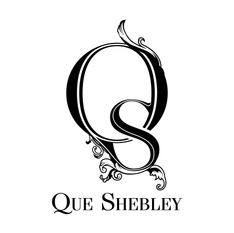 Que Shebley